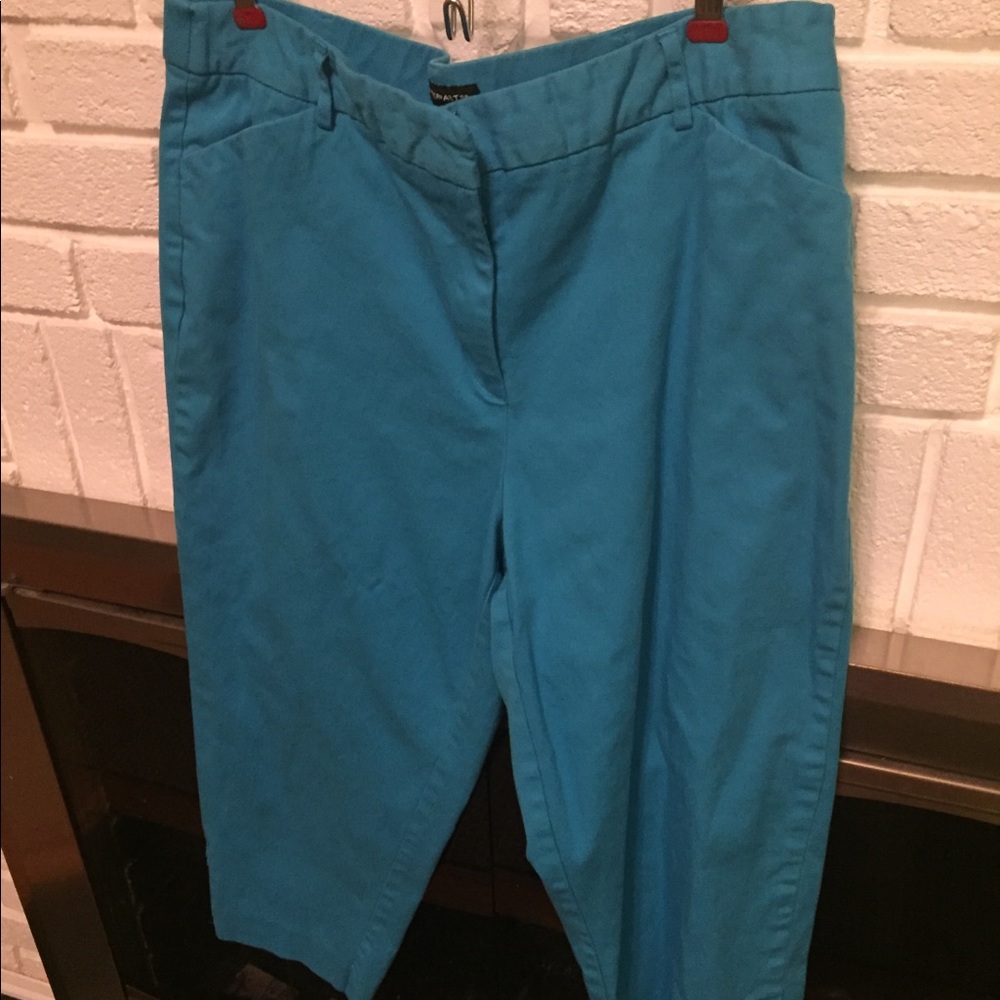 Turquoise capris with button detail